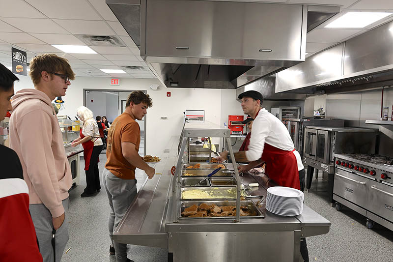 Student ordering food in cafe