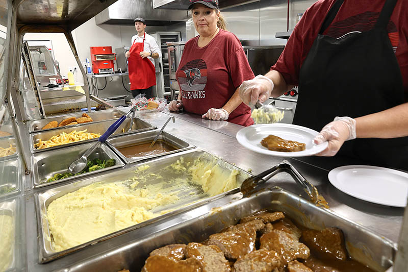 Food in hot trays being served