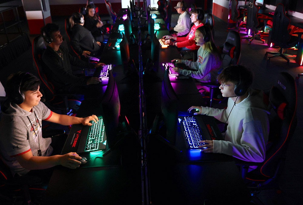 SCC eSports Tournament students sitting at gaming pc's