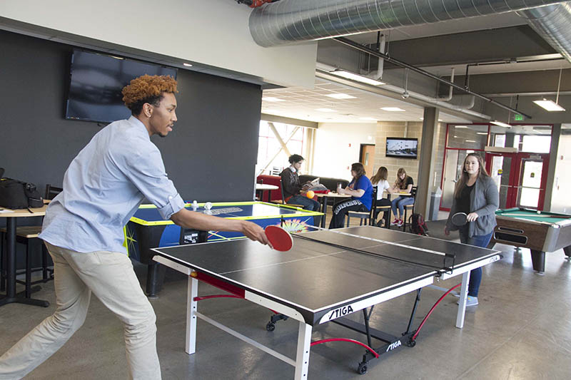 Students playing ping pong