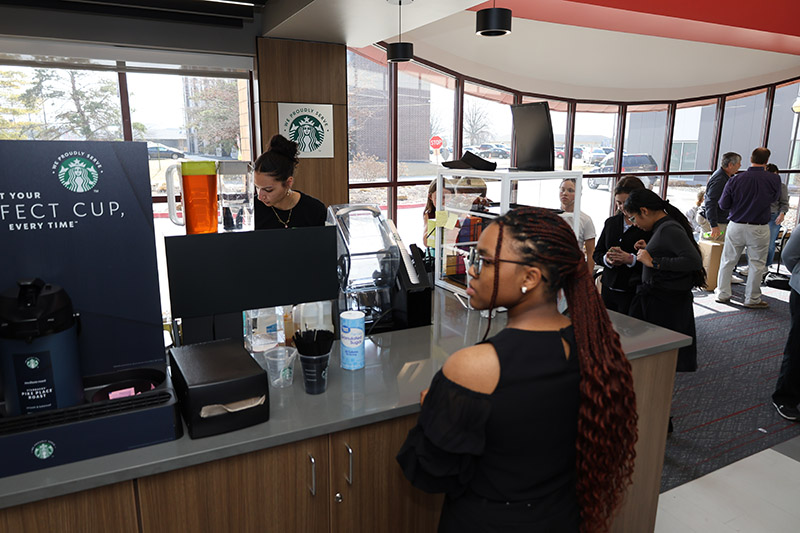 Students gathered around coffee counter
