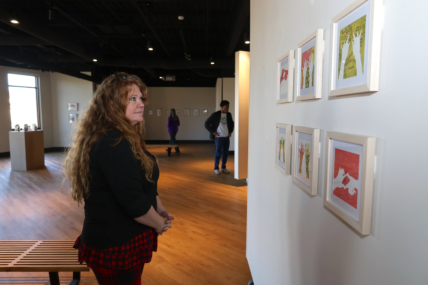 Woman observing art in art gallery