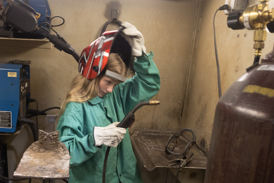 Kidtek student works on her welding project