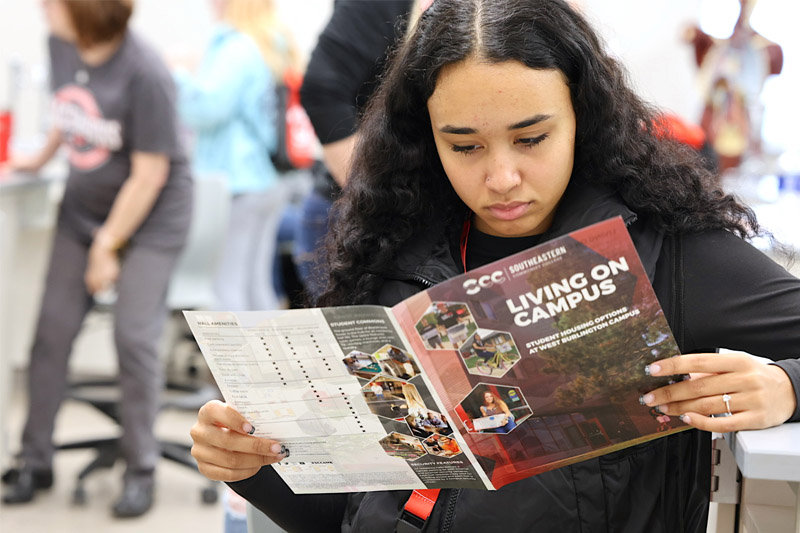 Blackhawk Visit Day Student looking at phamplet