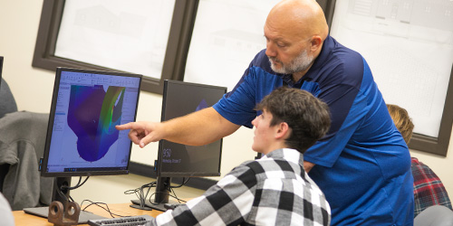 student and instructor in the CAD lab