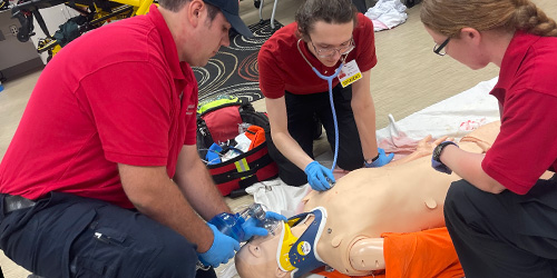 EMS students treating a simulation patient