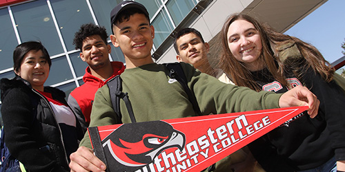 International students with a pennant