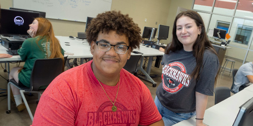 two students in a computer lab