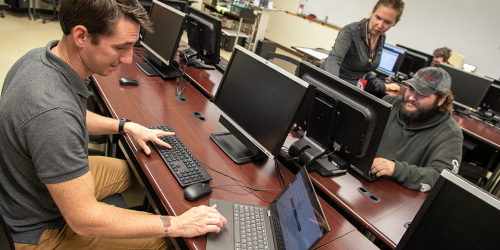 students working on networking computers