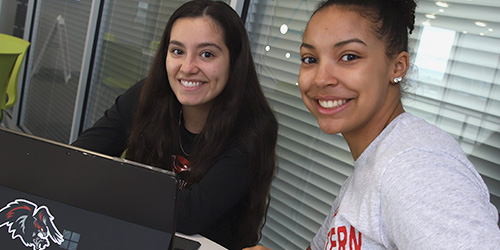 two female students studying