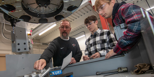 student in machining lab