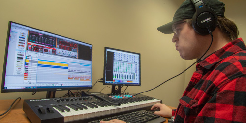 male student in digital music lab