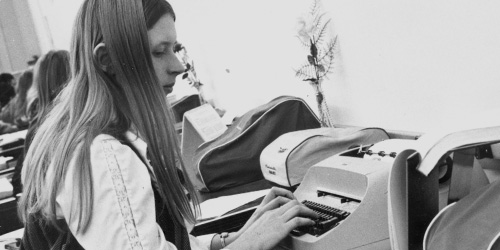 old photo of student in typing class