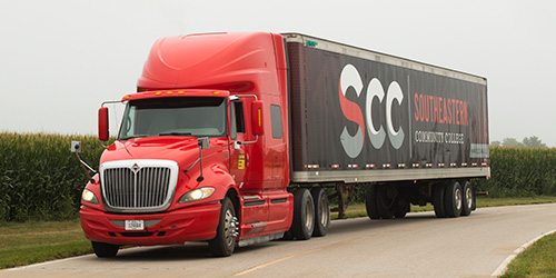 SCC semi driving down road