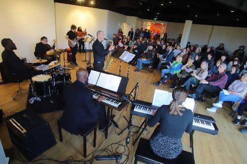 MLK tribute concert with keyboards, drums, saxaphone, guitar and audience