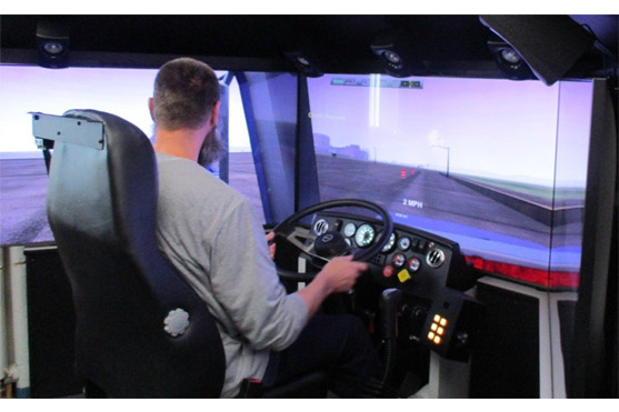 Man using semi truck simulator