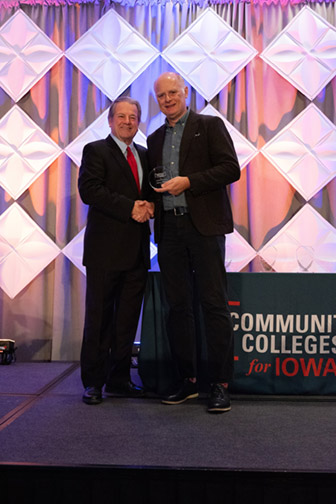 Jeff Ebbing and Dr. Ash Two men posing with award