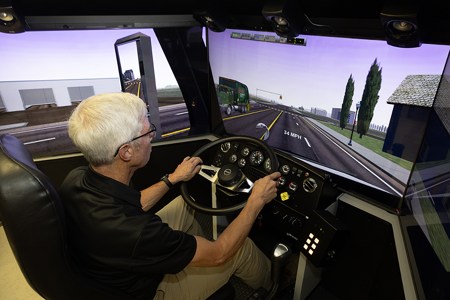Instructor using truck driving simulator