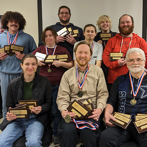 Computer Club students show off their competition awards