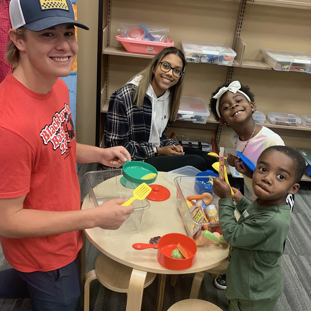 SCC students playing with preschool children