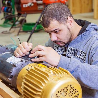 Student working on motor