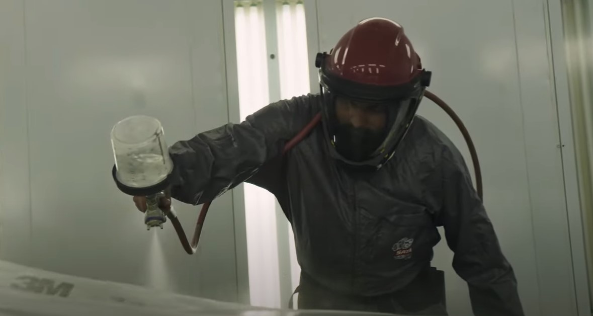 Applied tech student painting a car